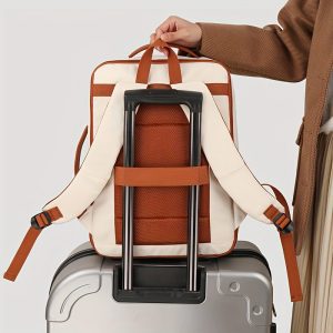 nylon backpack attached to a suitcase with luggage strap for travel