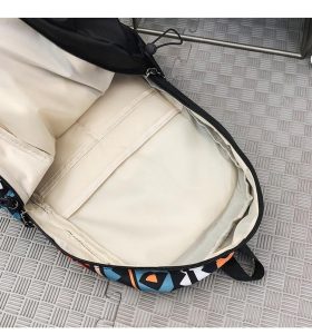 Interior of geometric print backpack showing spacious main compartment and lining