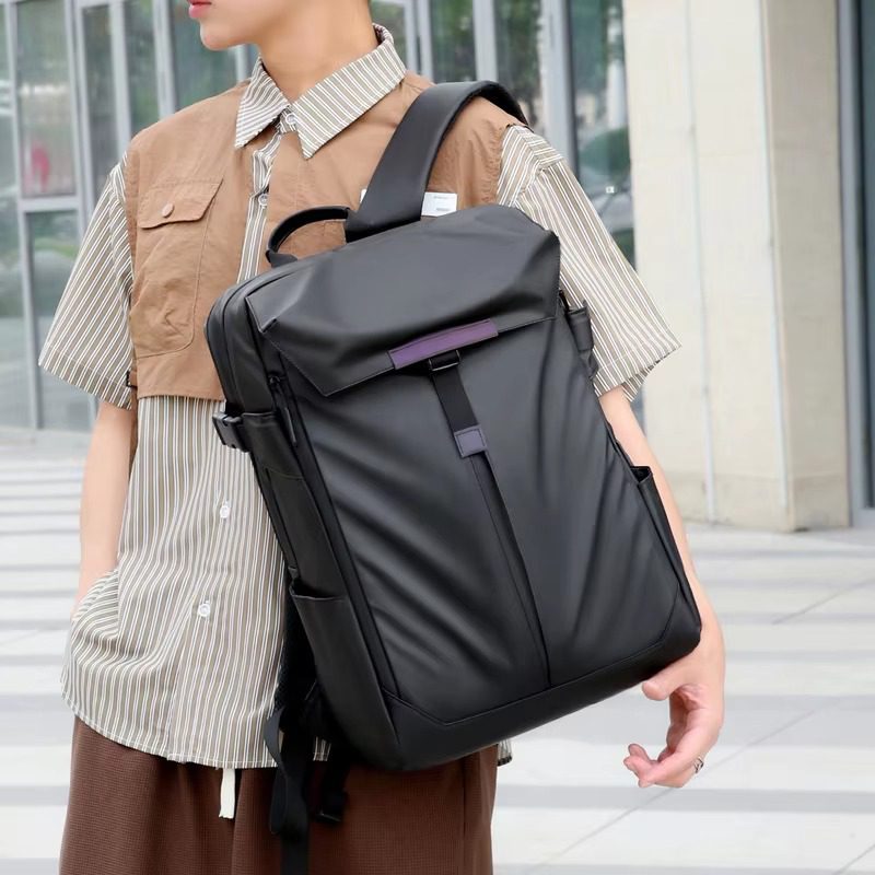 10 Man wearing black business backpack with striped shirts
