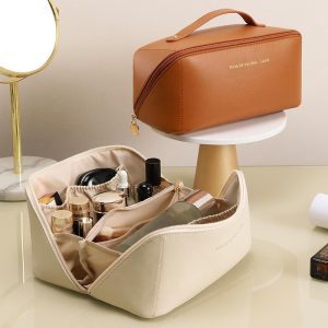 cream cosmetic bag with built-in elastic dividers holding skincare bottles
