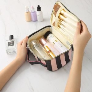 cosmetic bag with built-in makeup brush organizer and cosmetics inside 