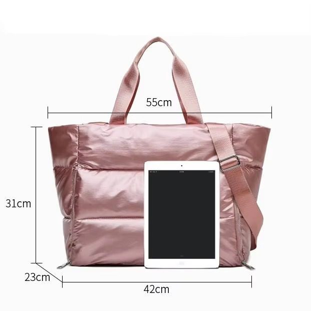 A metallic pink quilted gym tote bag with dimensions labeled next to a tablet showing it is 42cm wide.
